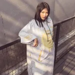 poncho de surf doré
