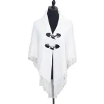 poncho en tricot frangé
