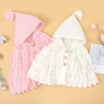 poncho pour nouveau-né en tricot